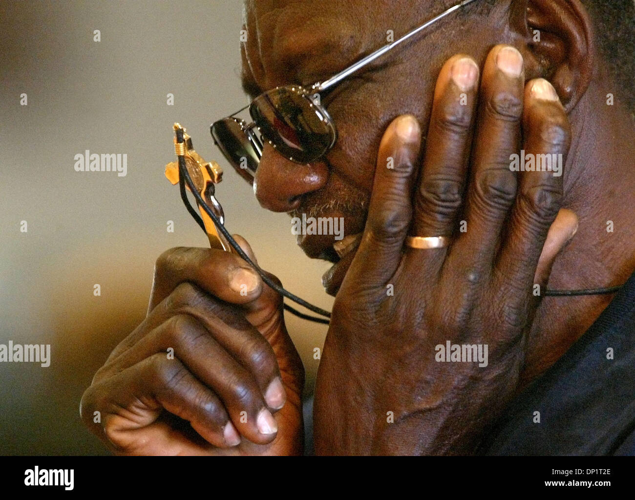 May 07, 2006; Delray Beach, FL, USA; A man holds his cross while he prays as Charismatic Christians worshiped at  Delray Beach's Our Lady of Perpetual Hope on Sunday. Mandatory Credit: Photo by Lannis Waters/Palm Beach Post/ZUMA Press. (©) Copyright 2006 by Palm Beach Post Stock Photo