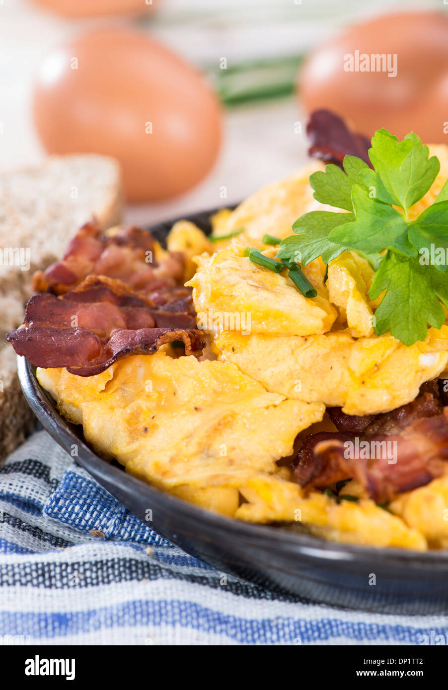 Scrambled Eggs with fresh eggs and herbs Stock Photo - Alamy