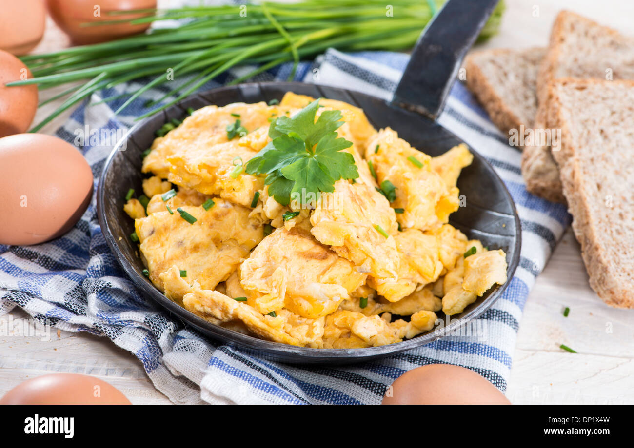 Scrambled Eggs with fresh eggs and herbs Stock Photo - Alamy