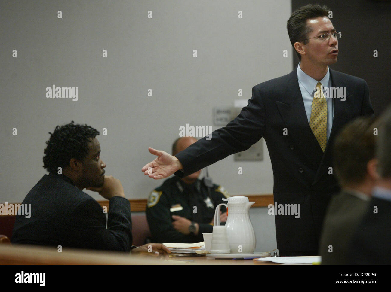 May 12, 2006; Ft. Pierce, FL, USA; At the St. Lucie County Courthouse friday,  defense attorney Michael Heisey gestures towards  his client, Jackson Vernelus, and states with emphasis to the assembled jury that Vernelus is innocent of murder charges.  Vernelus is accused of the  murder of Kenneth Agusta Mills Jr. in November, 2003.  Mandatory Credit: Photo by David Spencer/Palm Bea Stock Photo