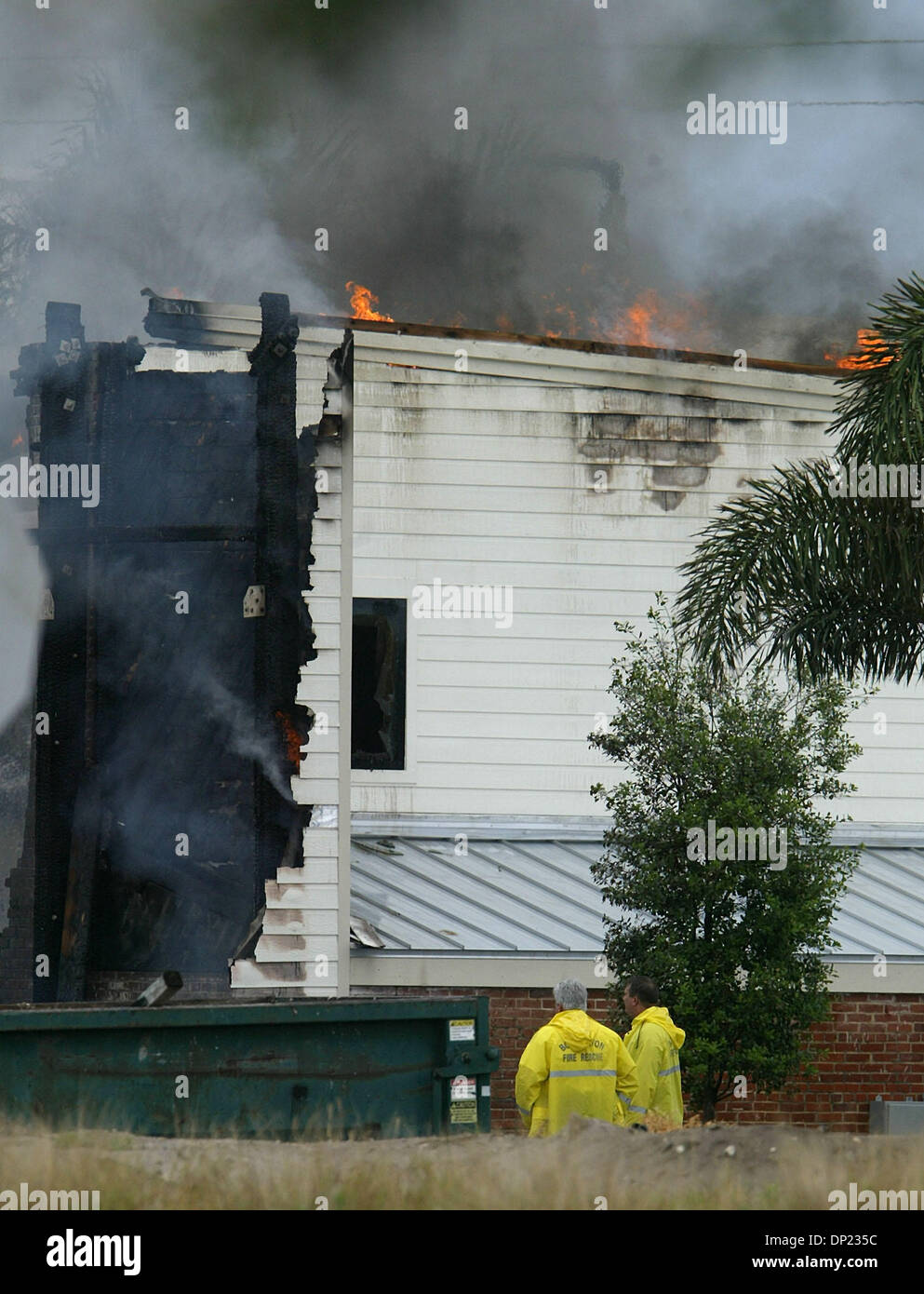 May 16, 2006; Boca Raton, FL, USA; Boca Raton firefighters inspect the still-burning T-3 building on the Boca Raton Florida Atlantic University campus as it burns to the ground Tuesday, May 16, 2006. Units from Boca Raton, Delray Beach, Boynton Beach, Palm Beach County and Deerfield Beach responded to the blaze. The building dates from World War II when it was used to house radar t Stock Photo