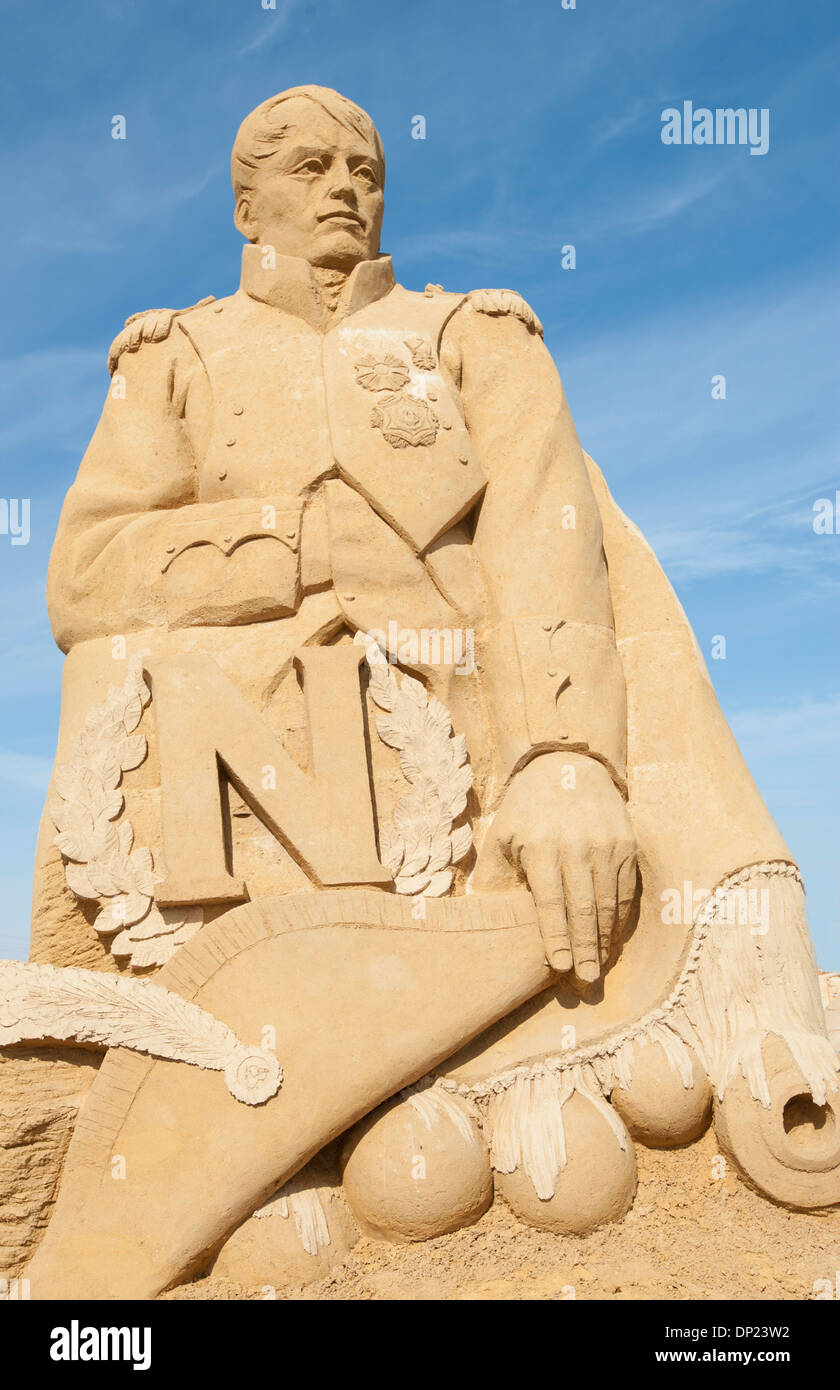 Large sand sculpture of emperor napoleon bonaparte against blue sky ...