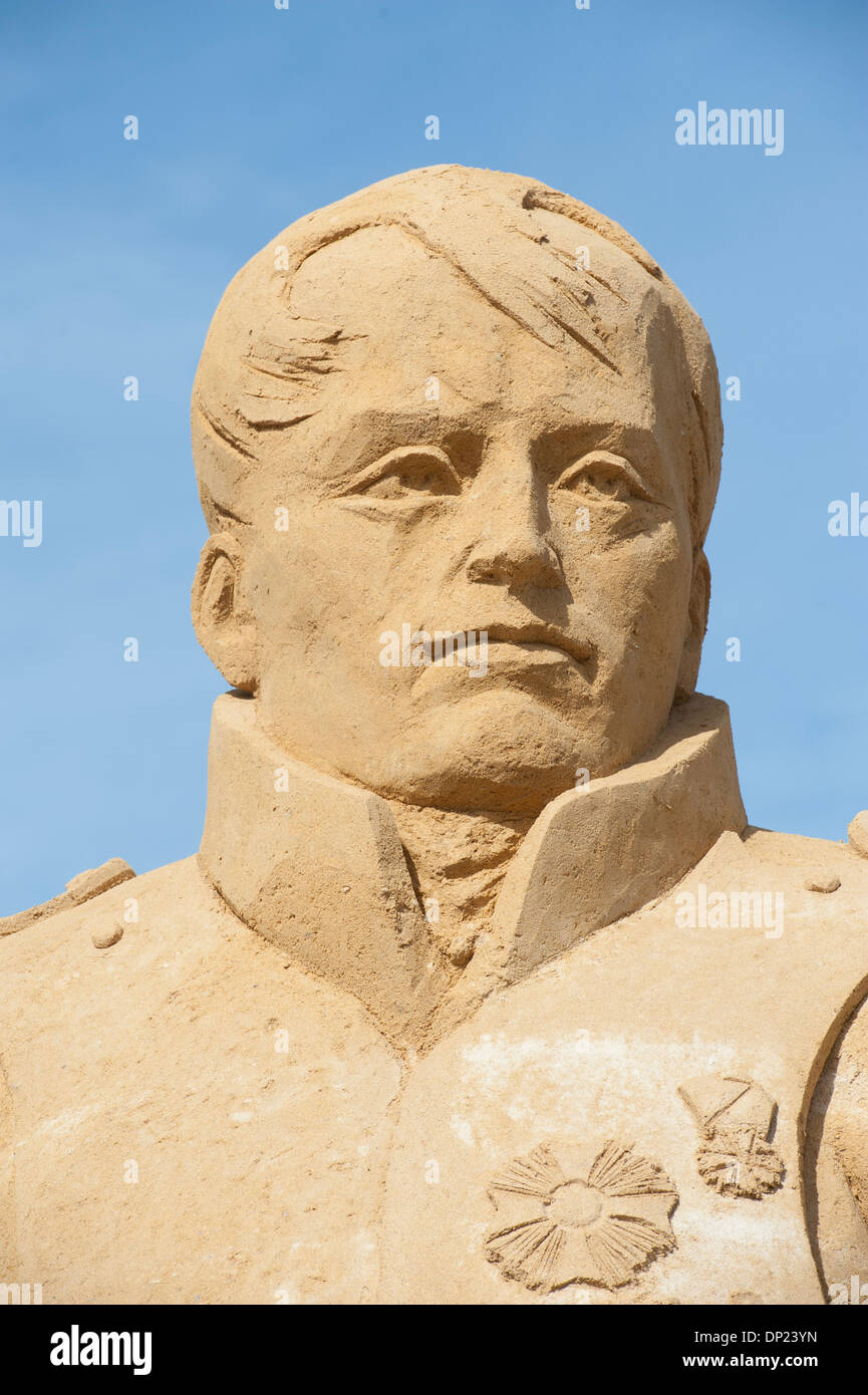 Large sand sculpture of emperor napoleon bonaparte against blue sky ...