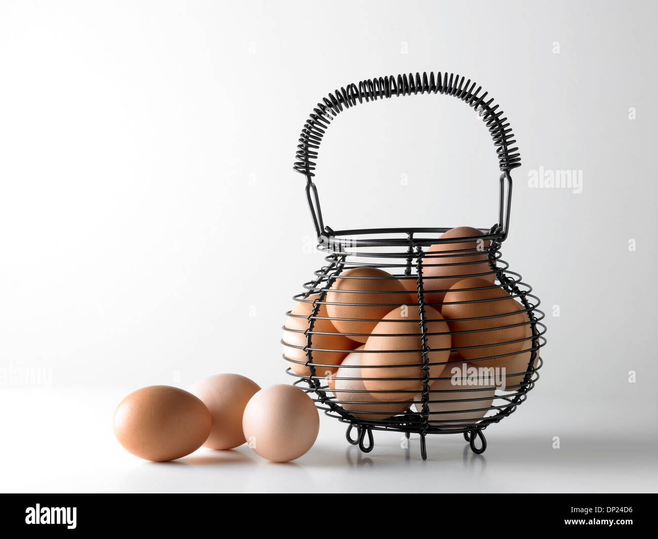 Eggs in wire basket Stock Photo Alamy