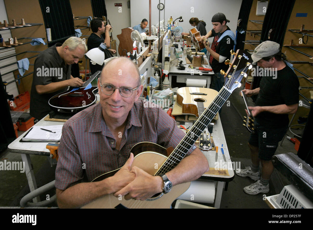 May 16, 2006; El Cajon, CA, USA; BOB TAYLOR, of Taylor Guitars poses for a  portrait with one of his guitarsin his factory in El Cajon. Taylor Guitars  makes top-line acoustic instruments