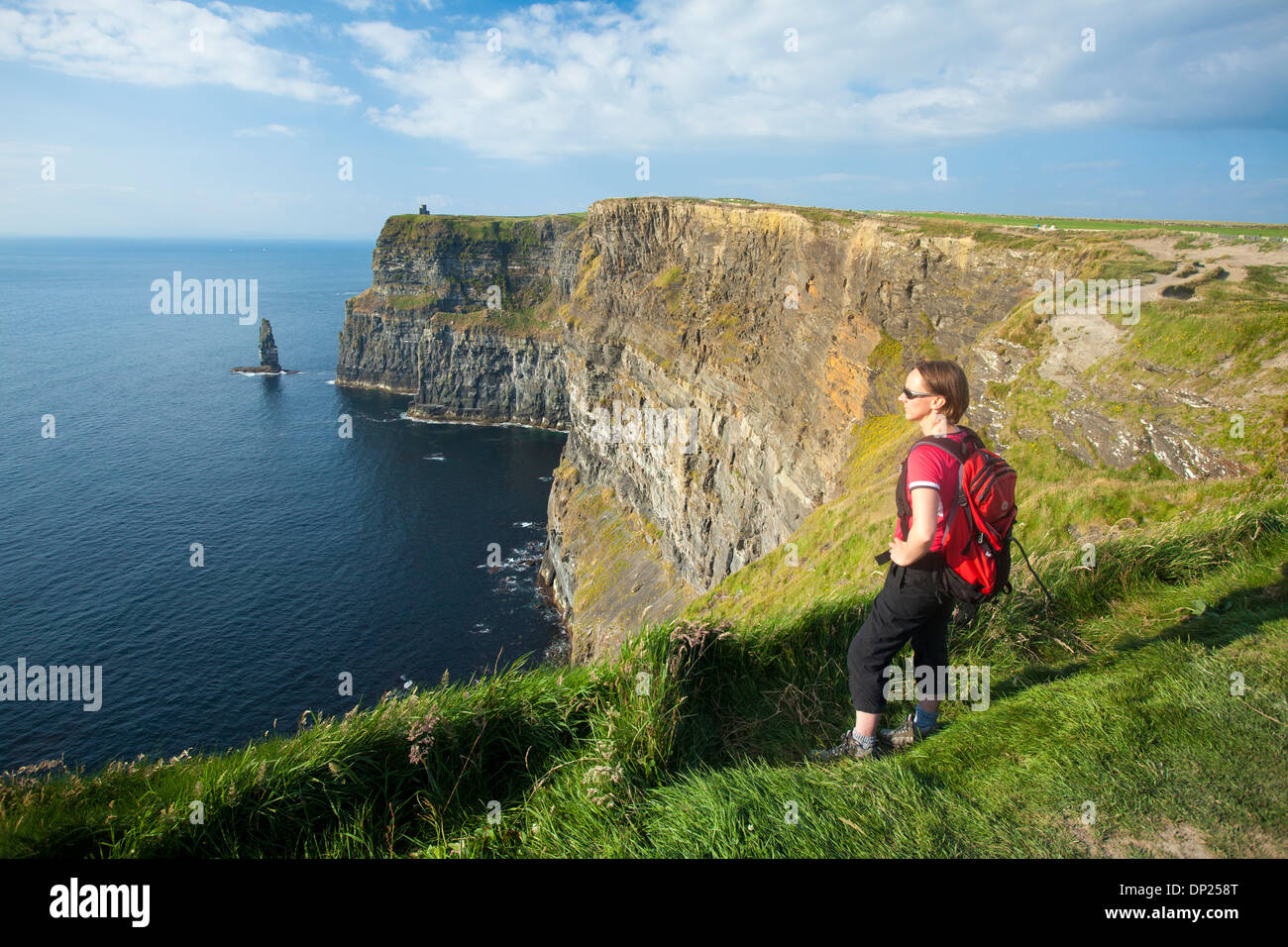 Walker on the Cliffs of Moher Coastal Path, County Clare, Ireland. Stock Photo