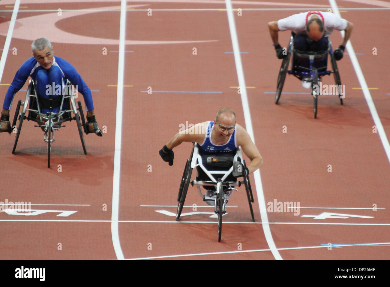 Toni Piispanen of Finland wins gold in the mens 100m - T51 in the Olympic stadium at the London 2012 Paralympic games. Stock Photo