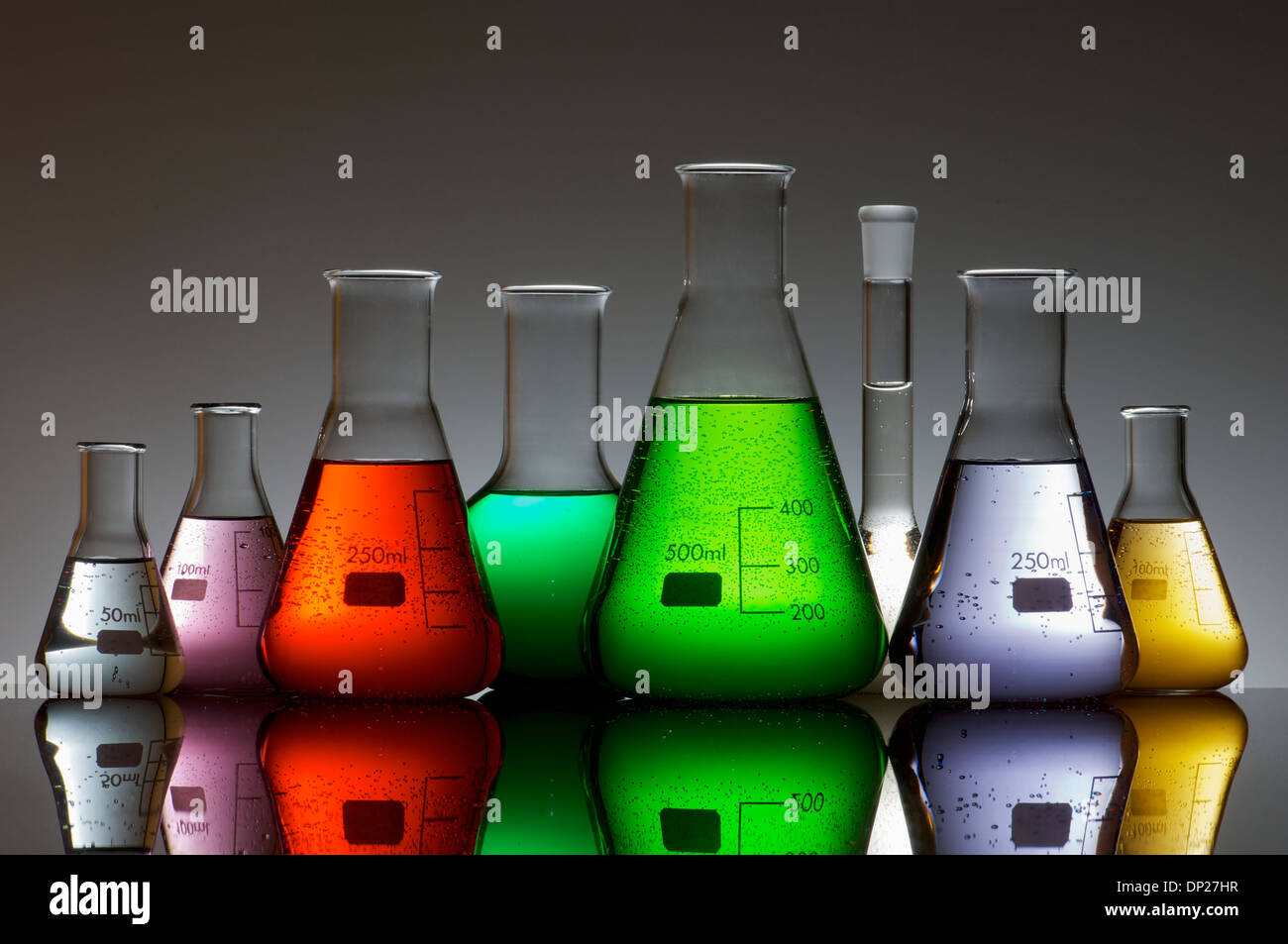 group of laboratory flasks containing liquid color Stock Photo Alamy
