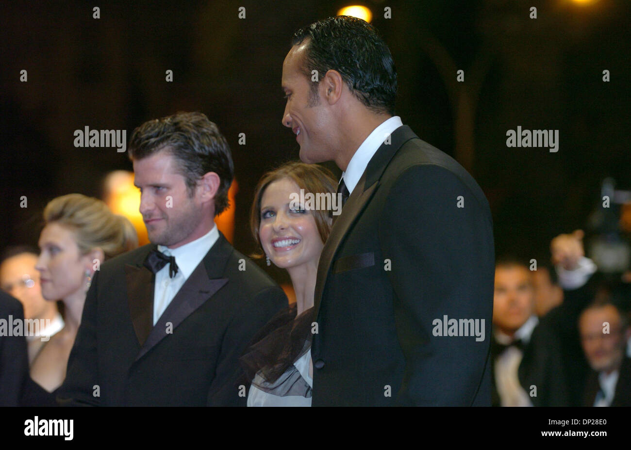 May 21, 2006; Cannes, FRANCE; Writer/director RICHARD KELLY with actors SARAH MICHELLE GELLAR and DWAYNE 'THE ROCK' JOHNSON at the 'Southland Tales' premiere at the 59th Cannes Film Festival. Mandatory Credit: Photo by Frederic Injimbert/ZUMA Press. (©) Copyright 2006 by Frederic Injimbert Stock Photo