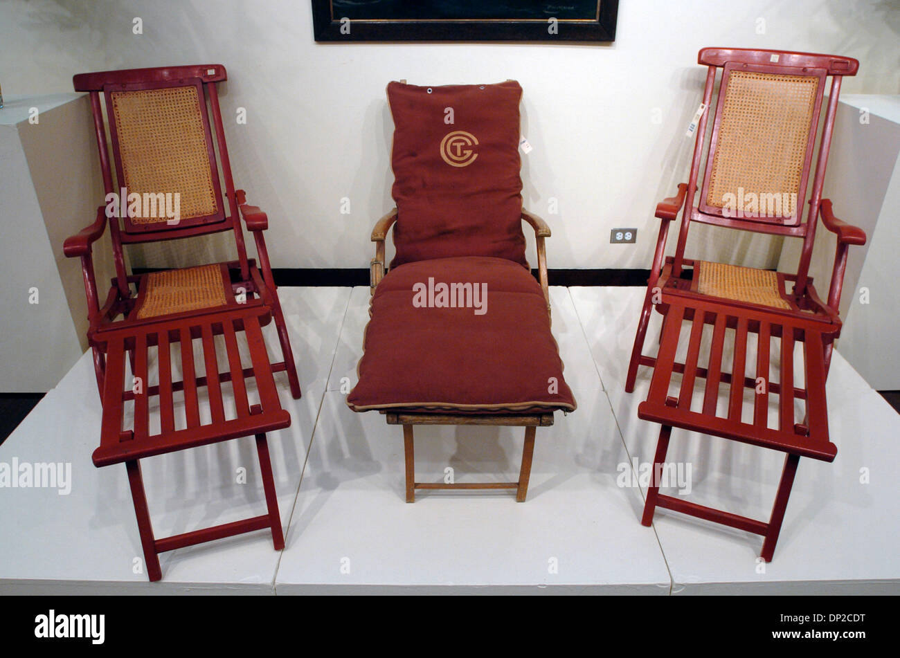 May 26, 2006; Manhattan, NY, USA; A pair of deck chairs from the S.S. Normandie, estimated to sell for U.S. $6,000-8,000 flank a deck chair from the French Line (C), estimated to sell for U.S. $2,500-3,500. Christie's New York 2006 'Ocean Liner Furnishings And Art' sale features two name boards and a house flag from Titanic life boats used during the 1912 sinking of the ocean liner Stock Photo