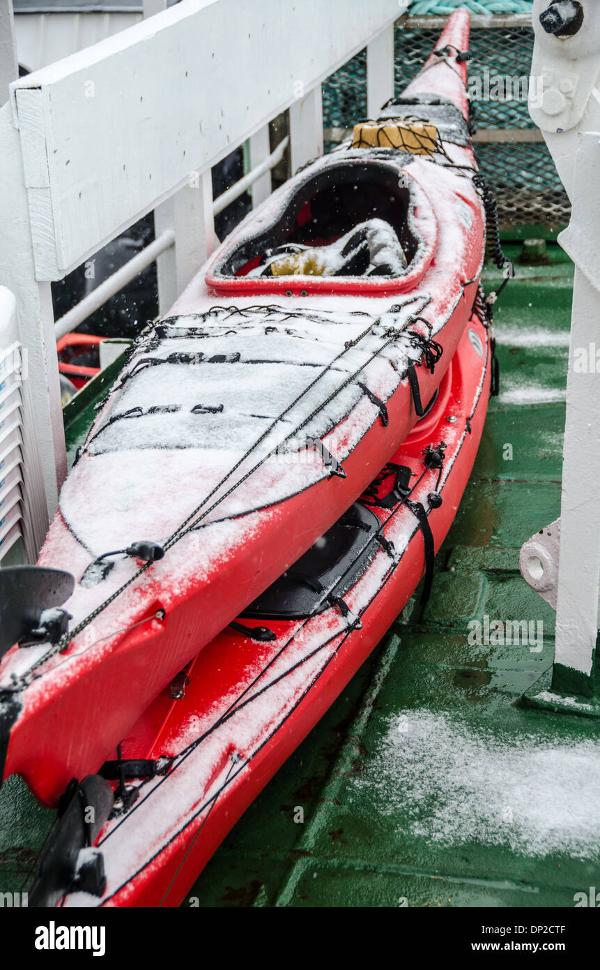 ANTARCTICA - Sea kayaks on the deck of a ship are covered in fresh snow in  Antarctica Stock Photo - Alamy