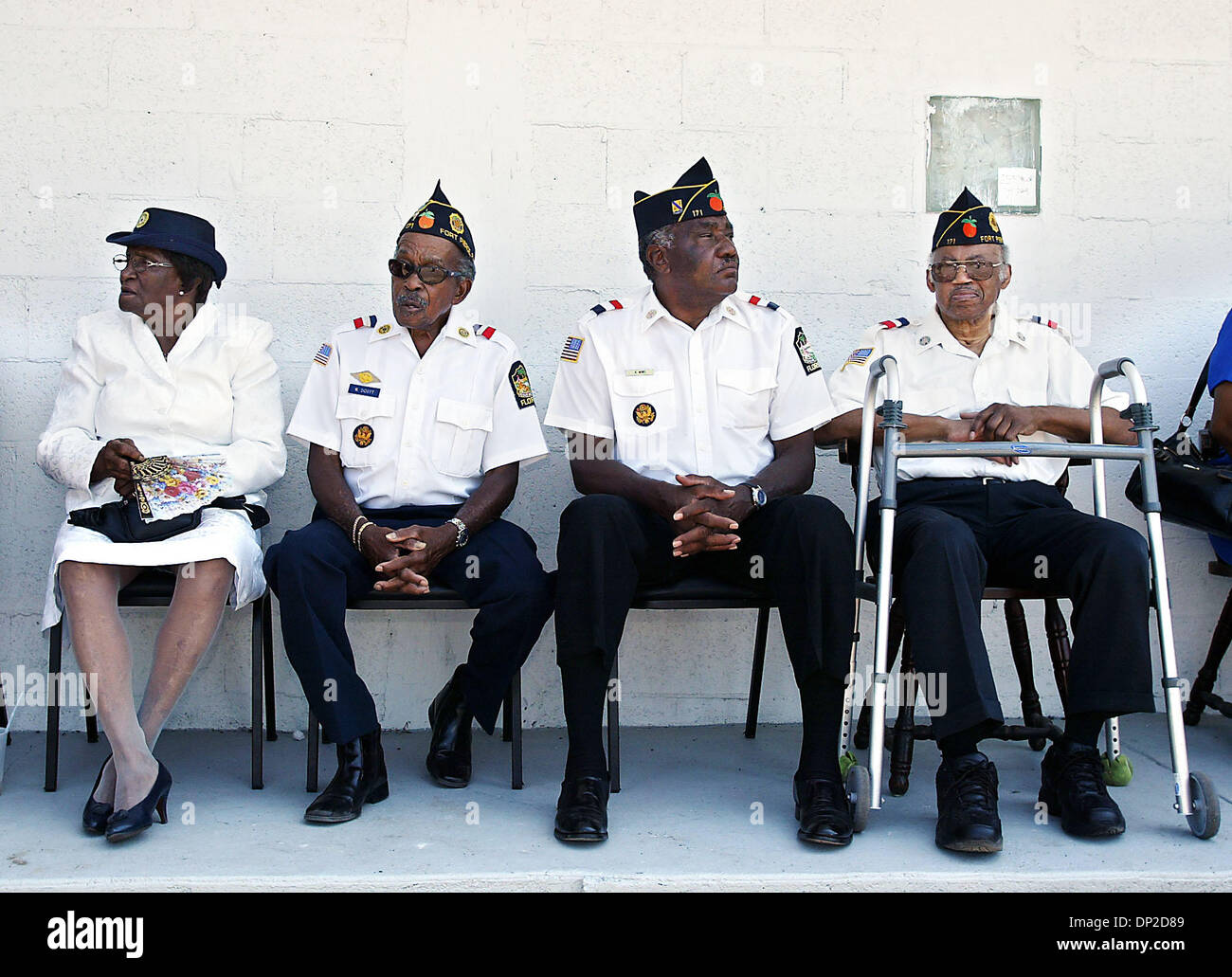 May 28, 2006; Fort Pierce, FL, USA; Mary Platt, from left, William B. Scott, Arstell(cq) Mims and William Rolle(cq) enjoy shade before the Memorial Day Service honoring soldiers from St. Lucie County at the Charles O. Hines American Legion Post 171 Sunday.  Mandatory Credit: Photo by Meghan McCarthy/Palm Beach Post/ZUMA Press. (©) Copyright 2006 by Palm Beach Post Stock Photo