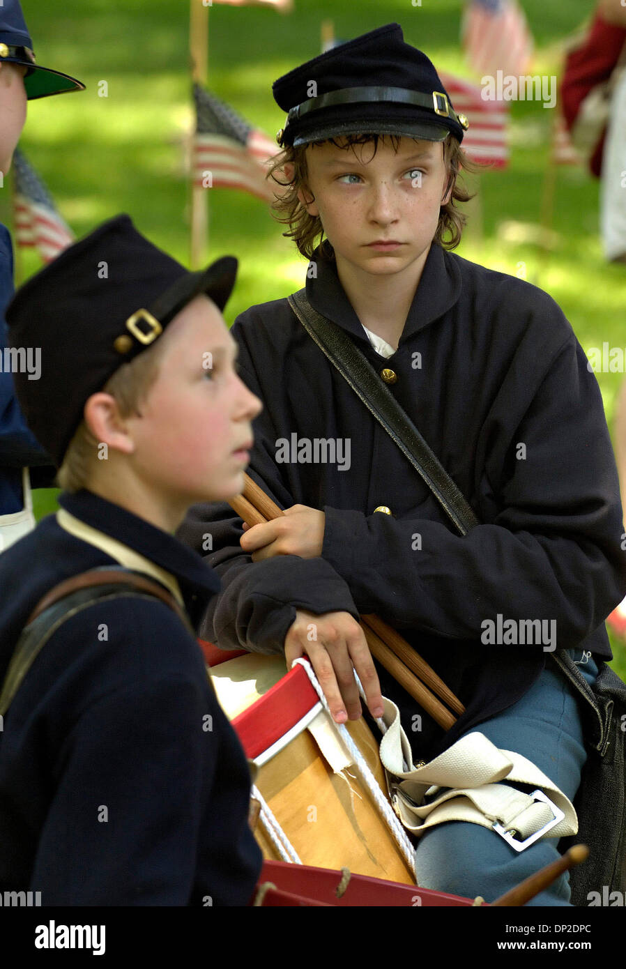 May 29, 2006; Minneapolis, MN, United States; Two drummer boys from the First Minnesota Volunteers, a Civil War re-enactment group, rested in the shade following the Memorial Ceremony at Lakwood Cemetery.  Waiting for the call to attention are 13 yr.old Joe Goff and 12 yr.old Grant Wilson, who past the time eating some hard tack. Mandatory Credit: Photo by David Brewster/Minneapoli Stock Photo