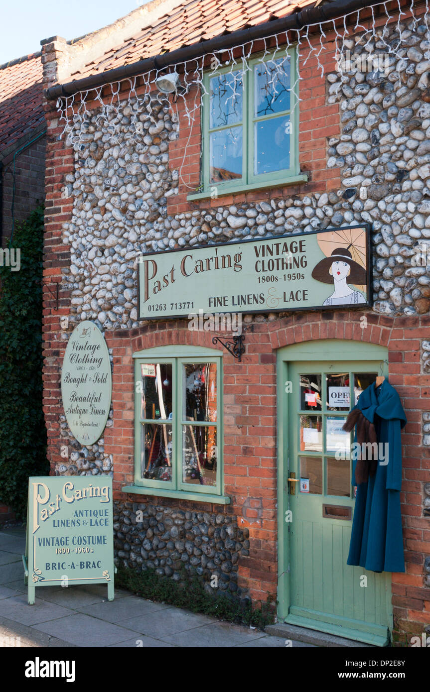 The shop premises of Past Caring vintage clothing shop in Holt, Norfolk. Stock Photo