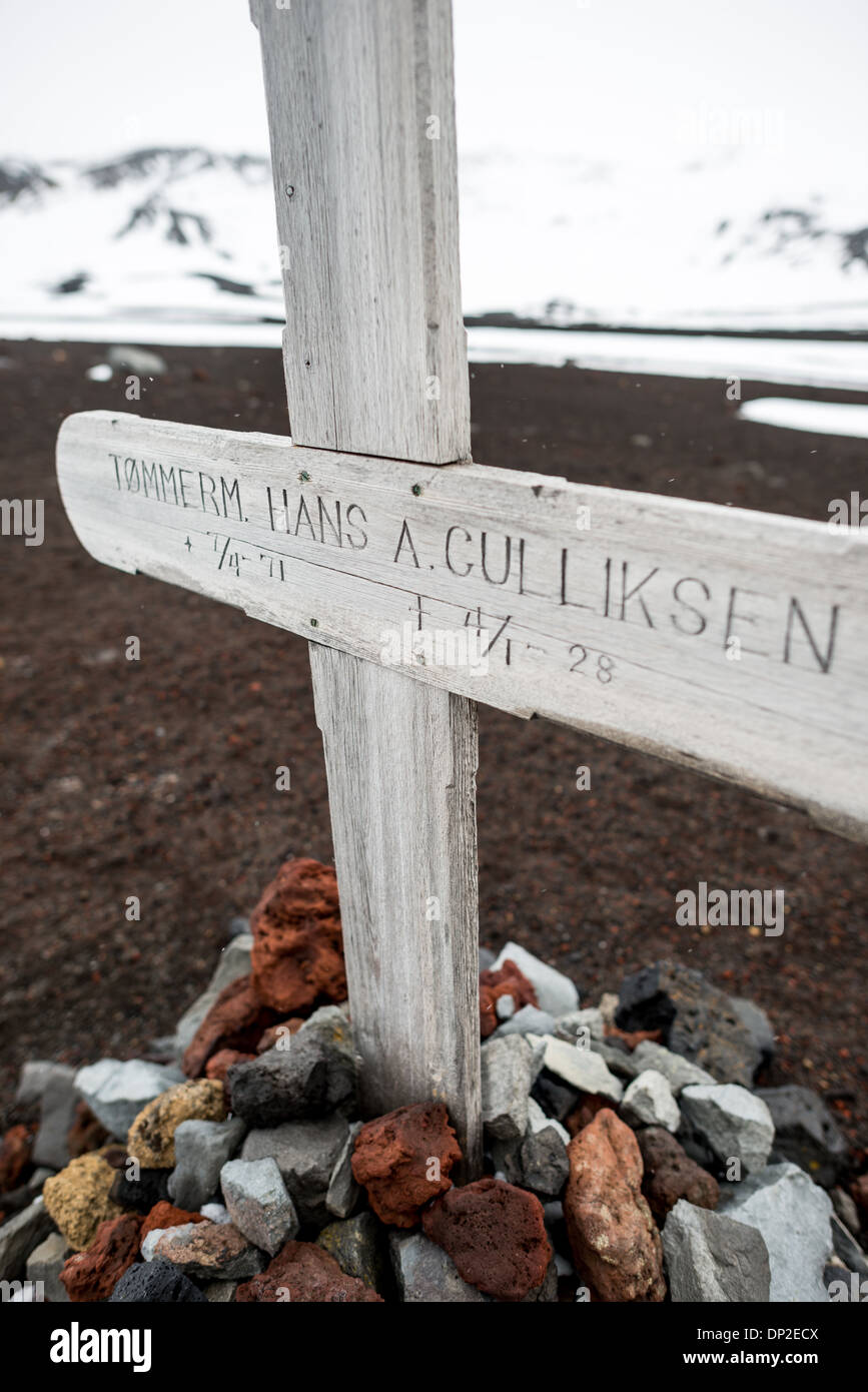 ANTARCTICA - A small cemetery at the former whaling station at Whalers Bay, Deception Island. Deception Island, in the South Shetland Islands, is a caldera of a volcano and is comprised of volcanic rock. Stock Photo