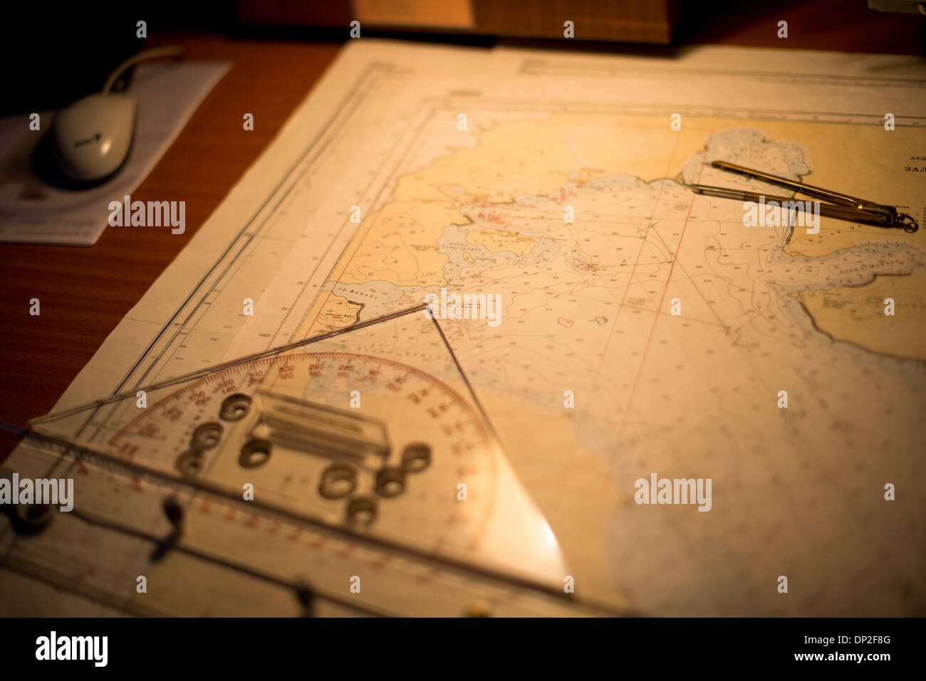 ANTARCTICA - Navigation charts on a map table on the bridge of an Antarctic cruise ship, the Polar Pioneer. Stock Photo