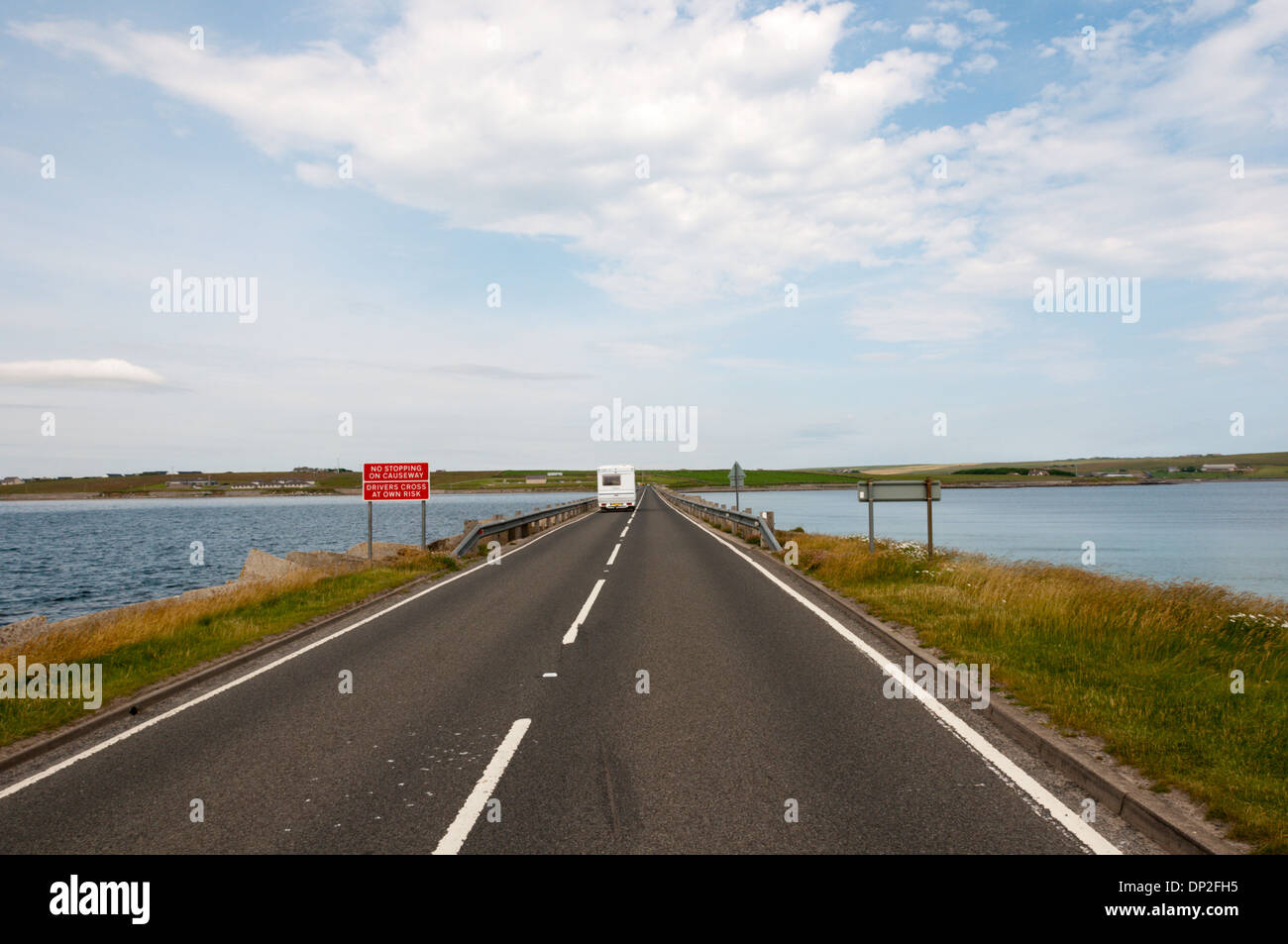 A motorhome crossing Churchill Barrier 1 between Lamb Holm and Mainland, Orkney. View is to north. Stock Photo