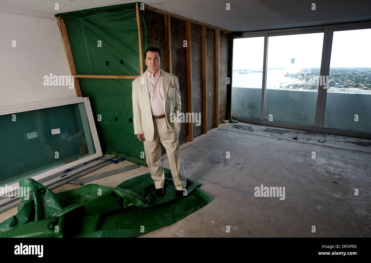 Jun 01, 2006; West Palm Beach, FL, USA; Christopher Horn in his condo unit; the area behind the barrier is still missing windows. Horn is one of more than 100 residents of 1515 Flagler Drive which was damaged by hurricanes in 2004 who haven't received any money from the condo's insurer QBE. Horn, 48, has been forced to live with his parents and soon may be forced to sell his condo  Stock Photo