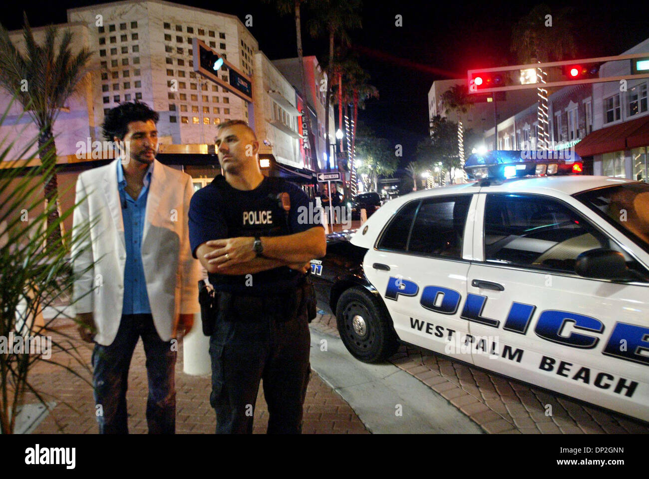 Jun 03, 2006; West Palm Beach, FL, USA; Alon Salomon, VIP host at Release,  seeks the help of Officer Swiderski (waiting for confirmation of officer's  first name and spelling of last) for