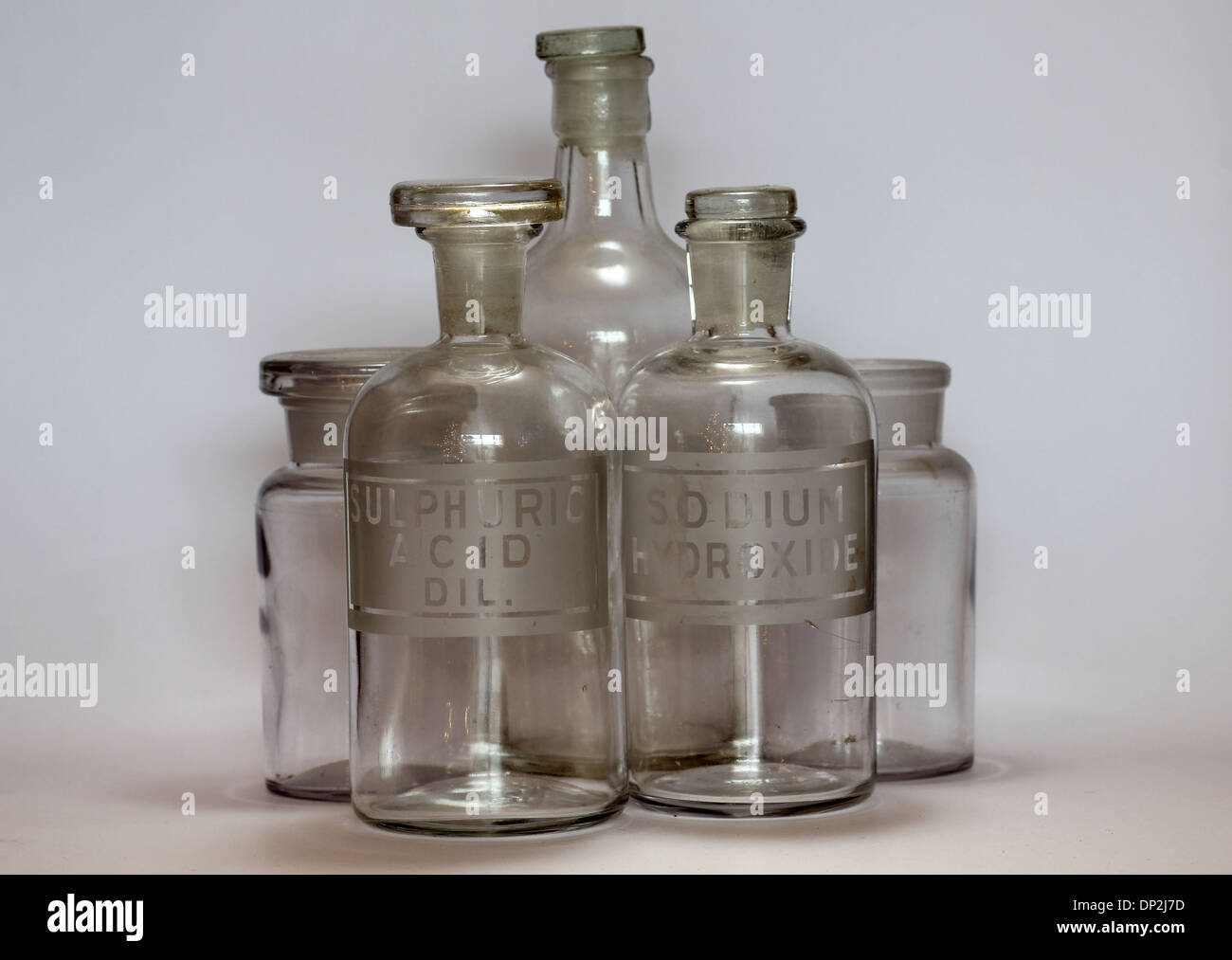 old chemistry bottle labeled for Sulphuric Acid Diluted and Sodium Hydroxide Stock Photo
