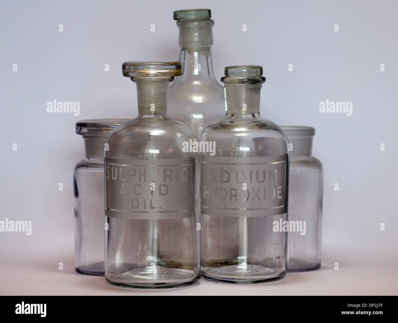 old chemistry bottle labeled for Sulphuric Acid Diluted and Sodium Hydroxide Stock Photo