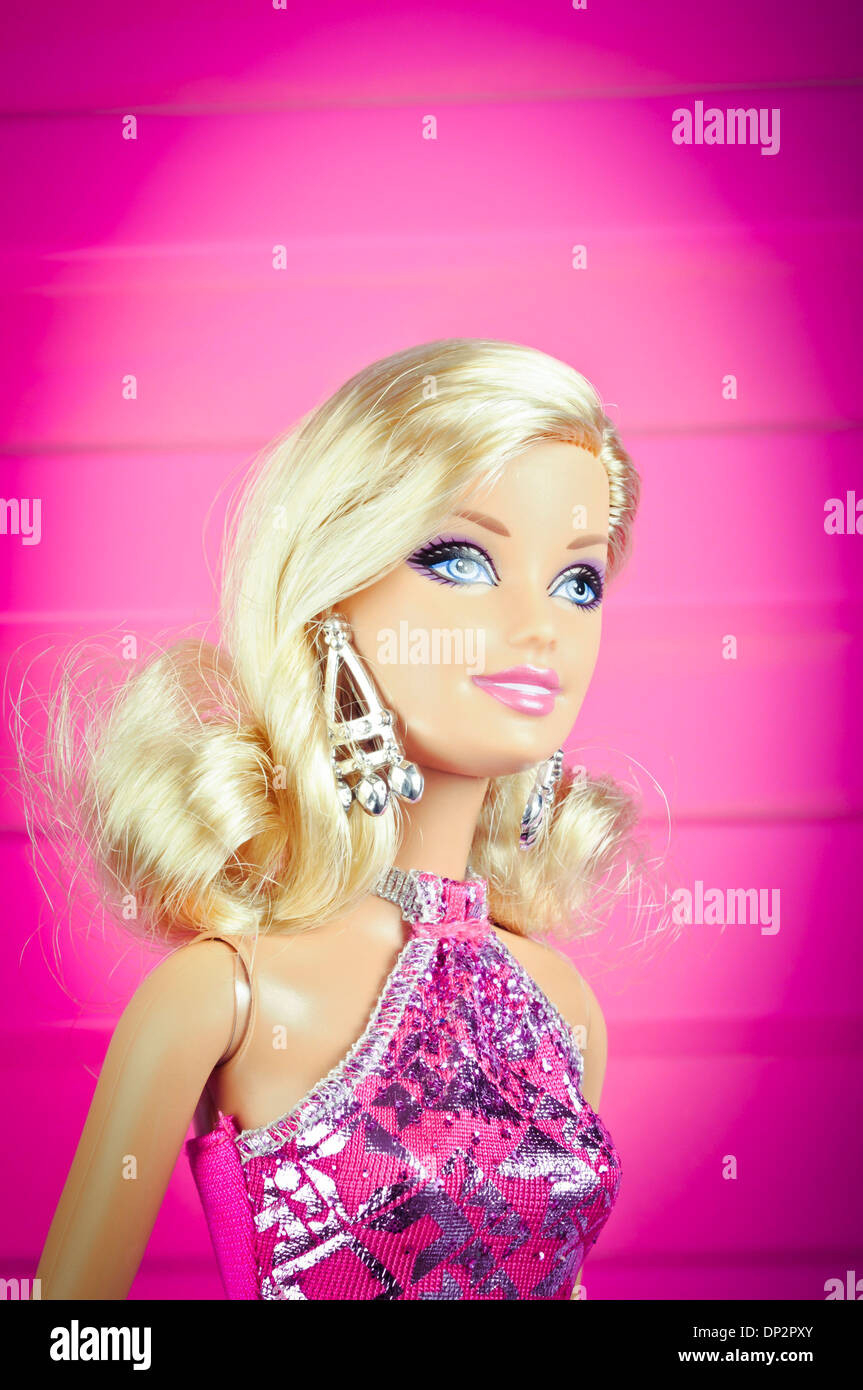 Barbie in pink dress over pink background Stock Photo - Alamy