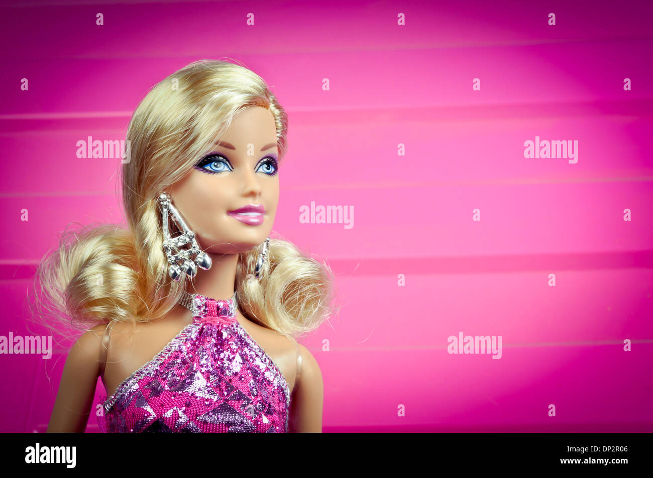 Barbie in pink dress over pink background Stock Photo