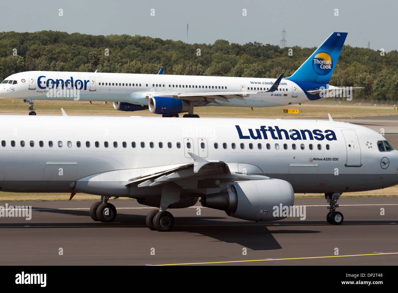 Lufthansa Airbus A320-200 and Condor Airways Boeing 757-300, Dusseldorf International airport, Germany. Stock Photo