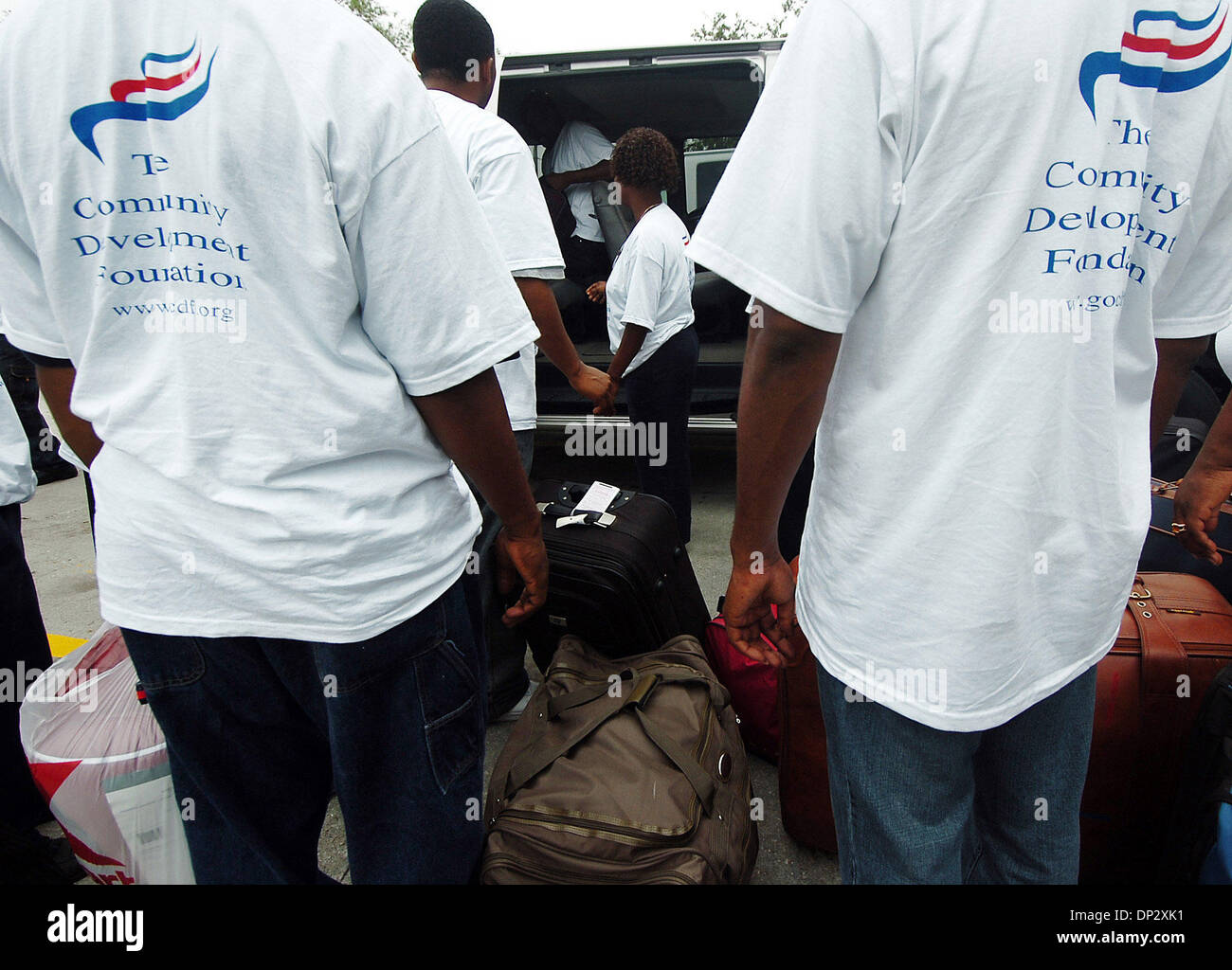 Jun 12, 2006; Belle Glade, FL, USA; Volunteers from the Community Development Foundation wait in