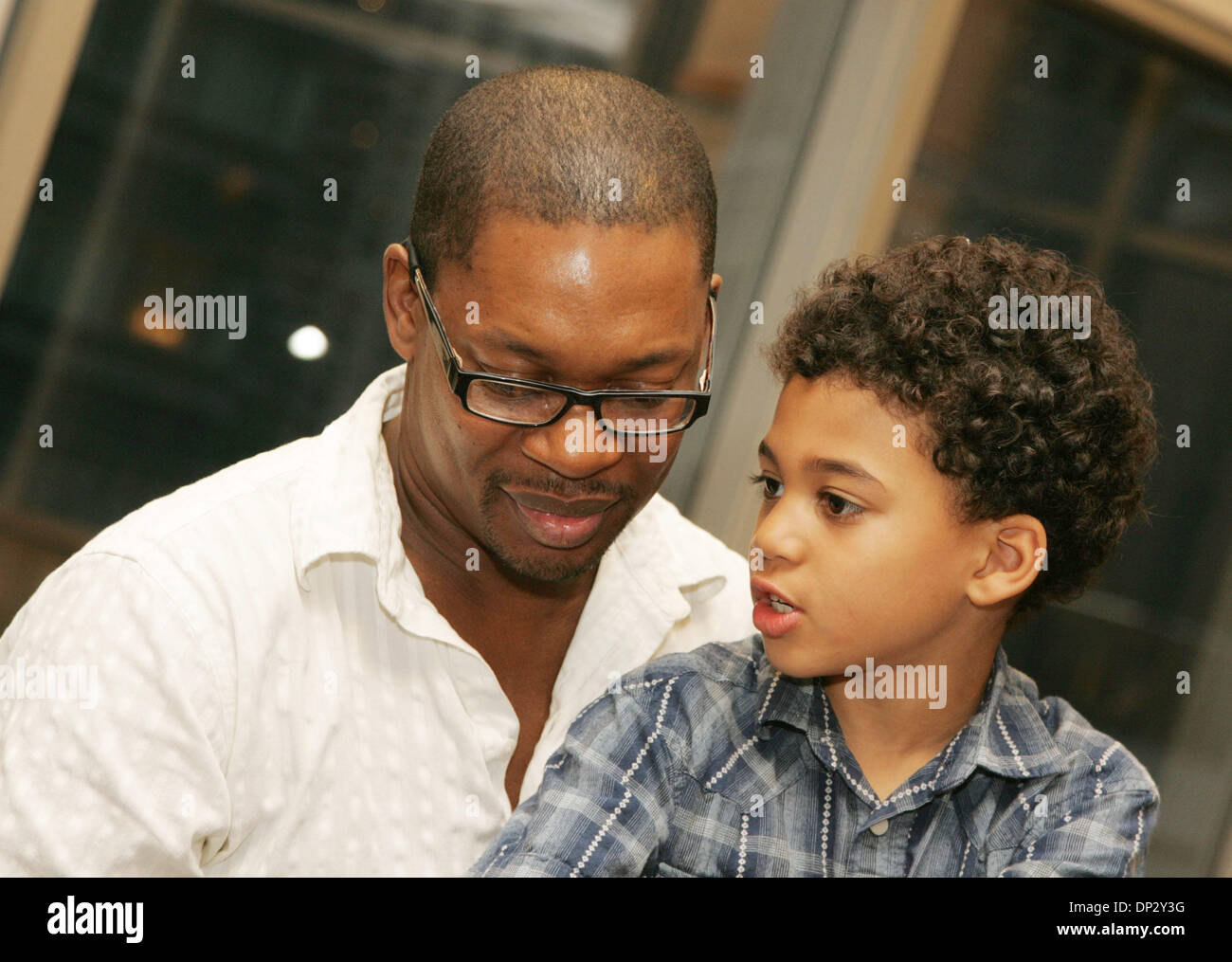 Jun 13, 2006; New York, NY, USA; Jazz saxophonist RAVI COLTRANE, son of  legendary jazz saxophonist John Coltrane ), and his son WILLIAM at the  lecture for the new book 'The House