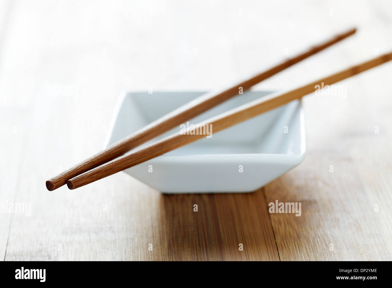 Chopsticks and bowl Stock Photo