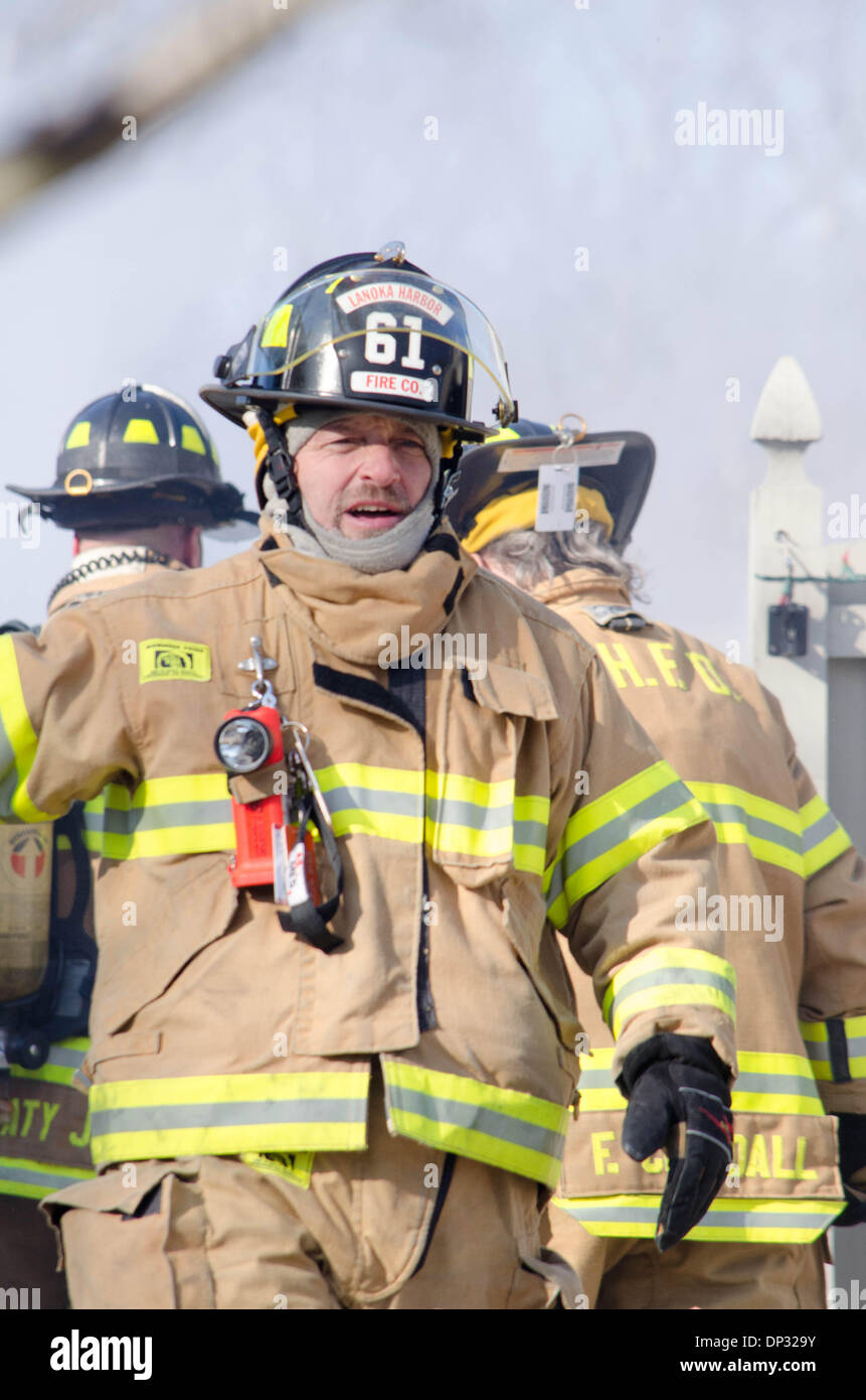 Forked River, New Jersey, USA. 7th January 2014.    LHFD FF Rizzo arrives for relief at Fire at 404 Continental  // Michael Glenn / Alamy Stock Photo