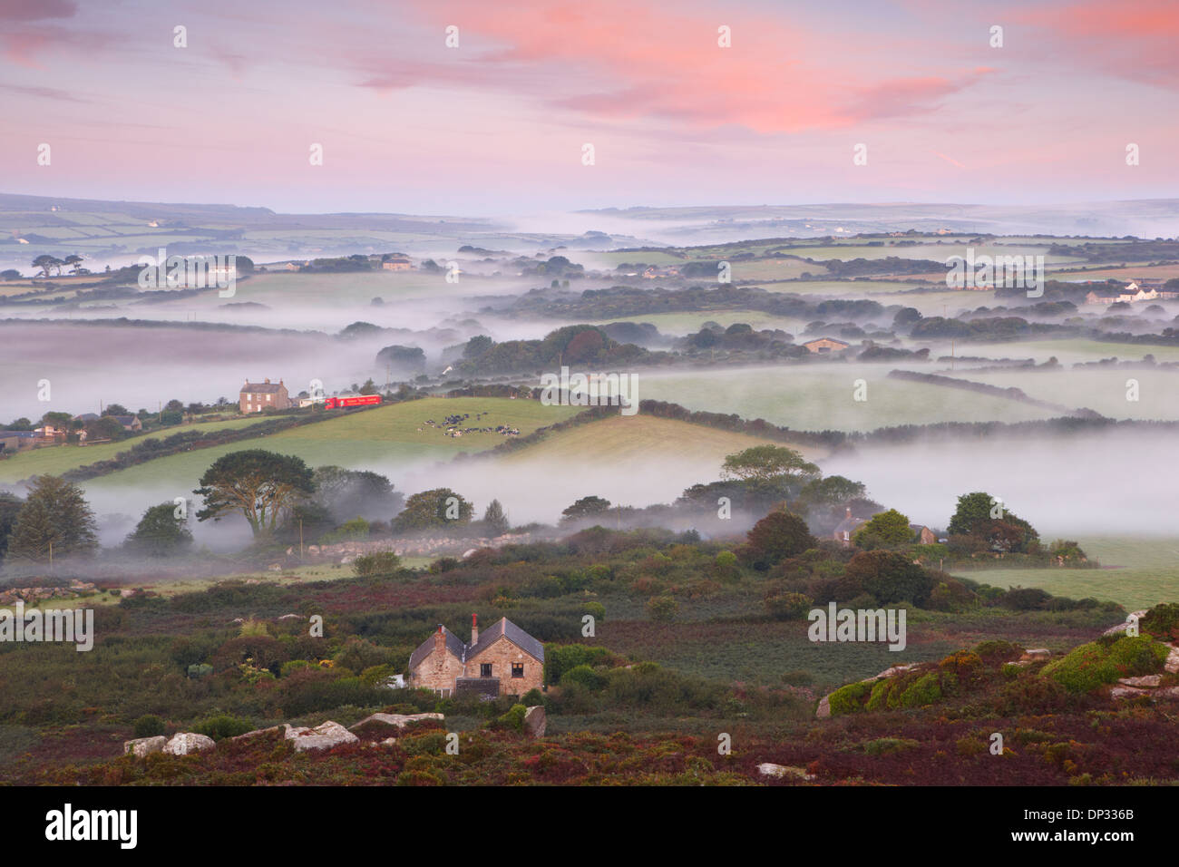 Pockets of mist floating over the Cornish countryside Stock Photo