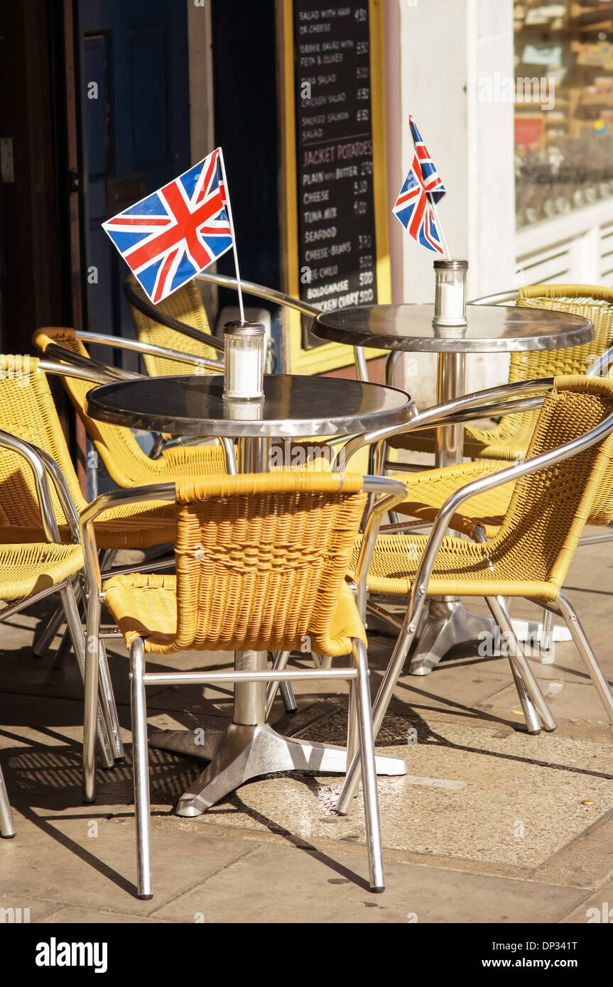 Tables and chairs outside restaurant in Camden Town, London England United Kingdom UK Stock Photo
