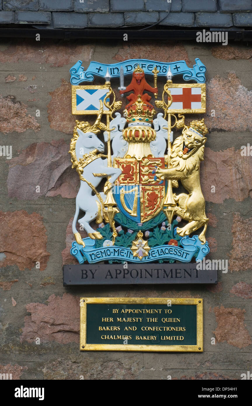 Royal warrant on the wall of a business in Ballater, Aberdeenshire, Scotland. Stock Photo