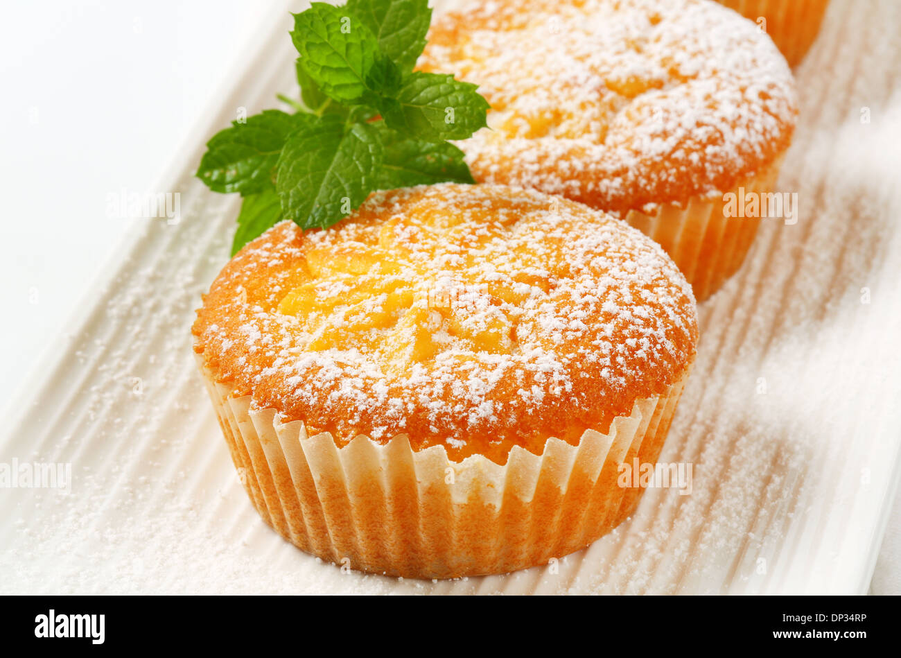 Custard filled muffins on long plate Stock Photo Alamy