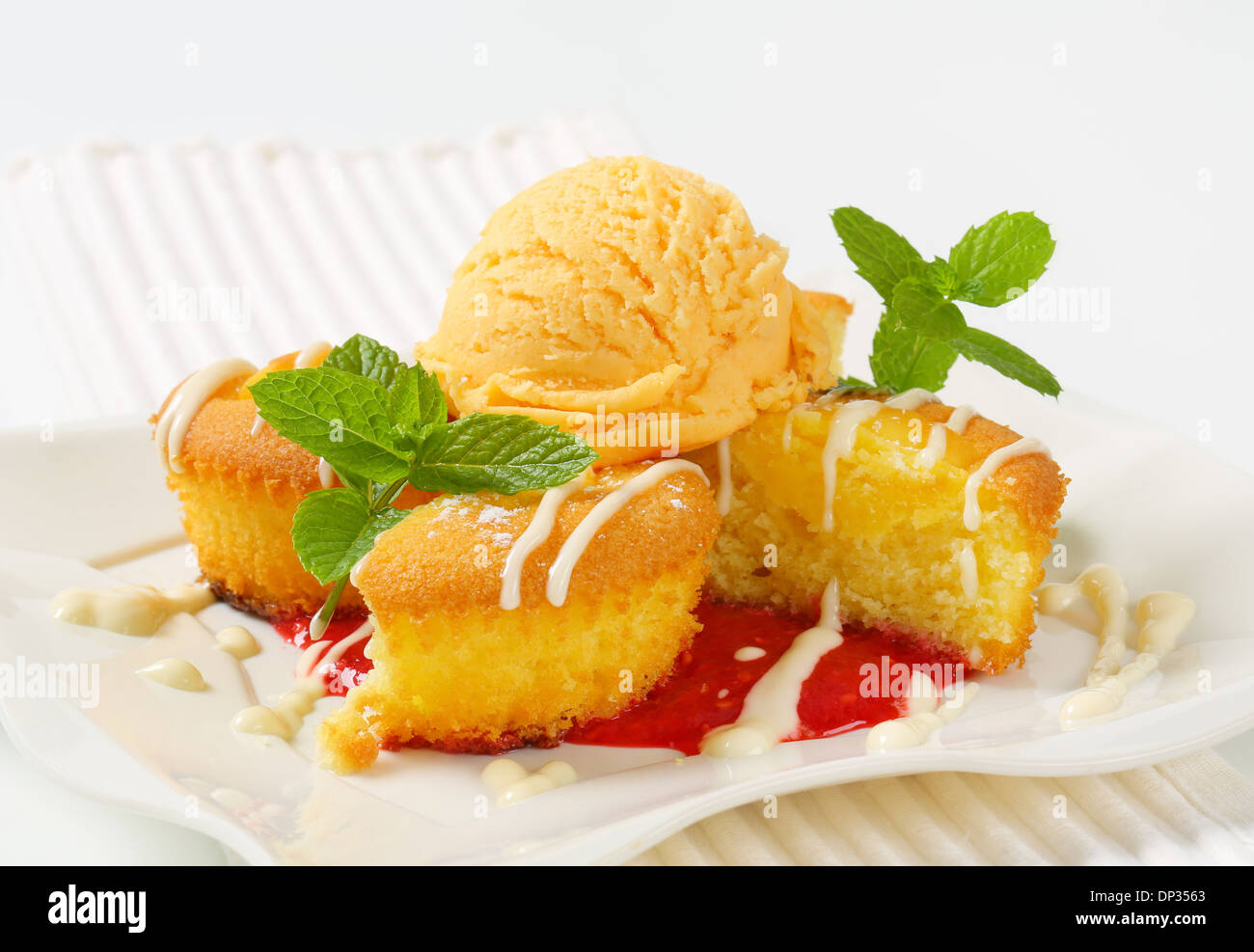 Custard filled muffins with scoop of ice cream Stock Photo Alamy