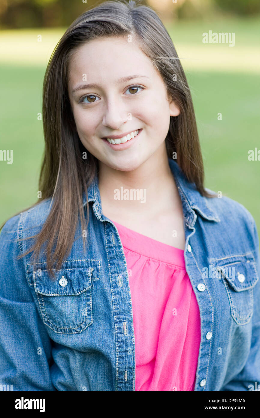 Portrait of pre-teen girl with long, brown hair, outdoors Stock Photo -  Alamy