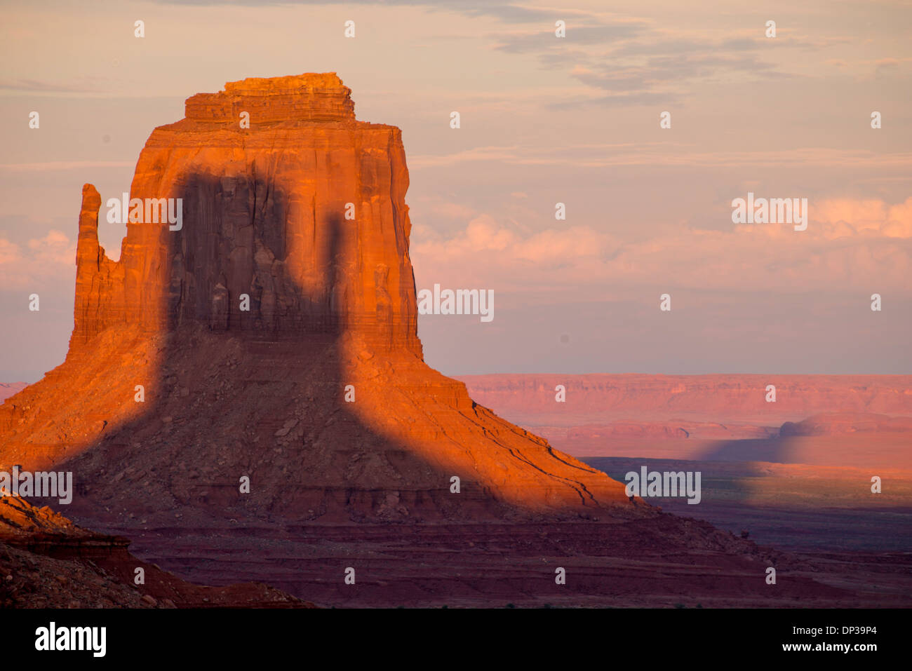 East Mitten at sunset, Monument Valley Tribal Park, Arizona/Utah Shadow of West Mitten on East Mitten Navajo Reservation Stock Photo