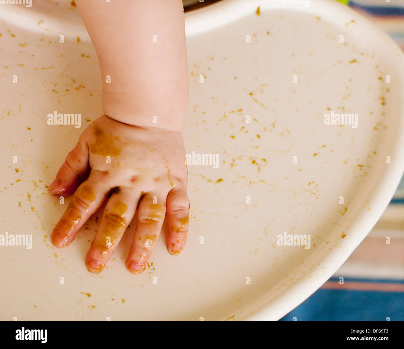 Messy baby hand Stock Photo