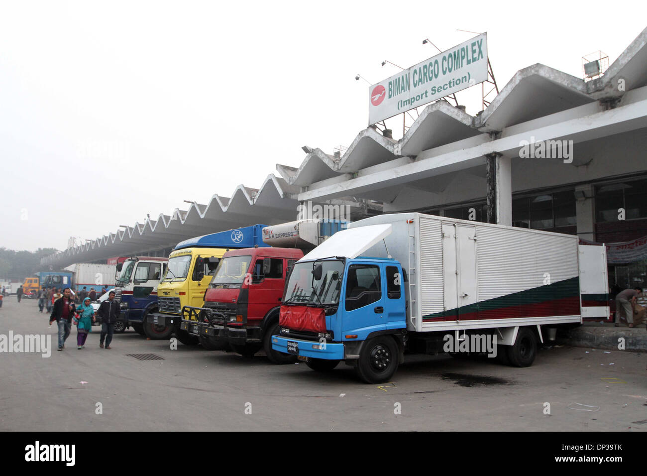 Workers unloading import material of Biman cargo complex on Hazrat Shahjalal International Airport in Dhaka on 07 Jan 2014. Stock Photo
