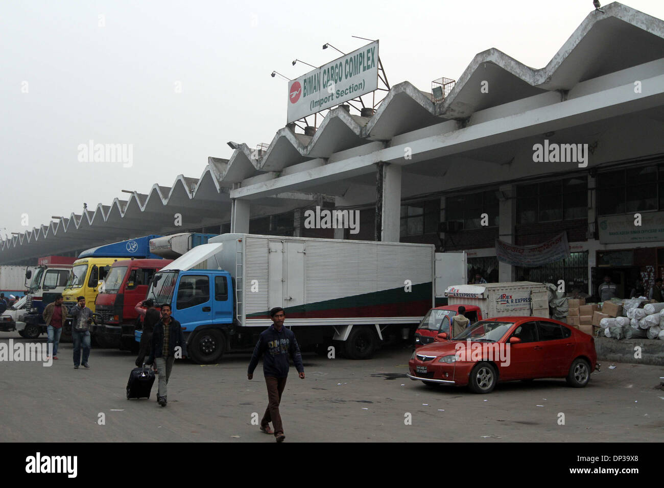 Workers unloading import material of Biman cargo complex on Hazrat Shahjalal International Airport in Dhaka on 07 Jan 2014. Stock Photo