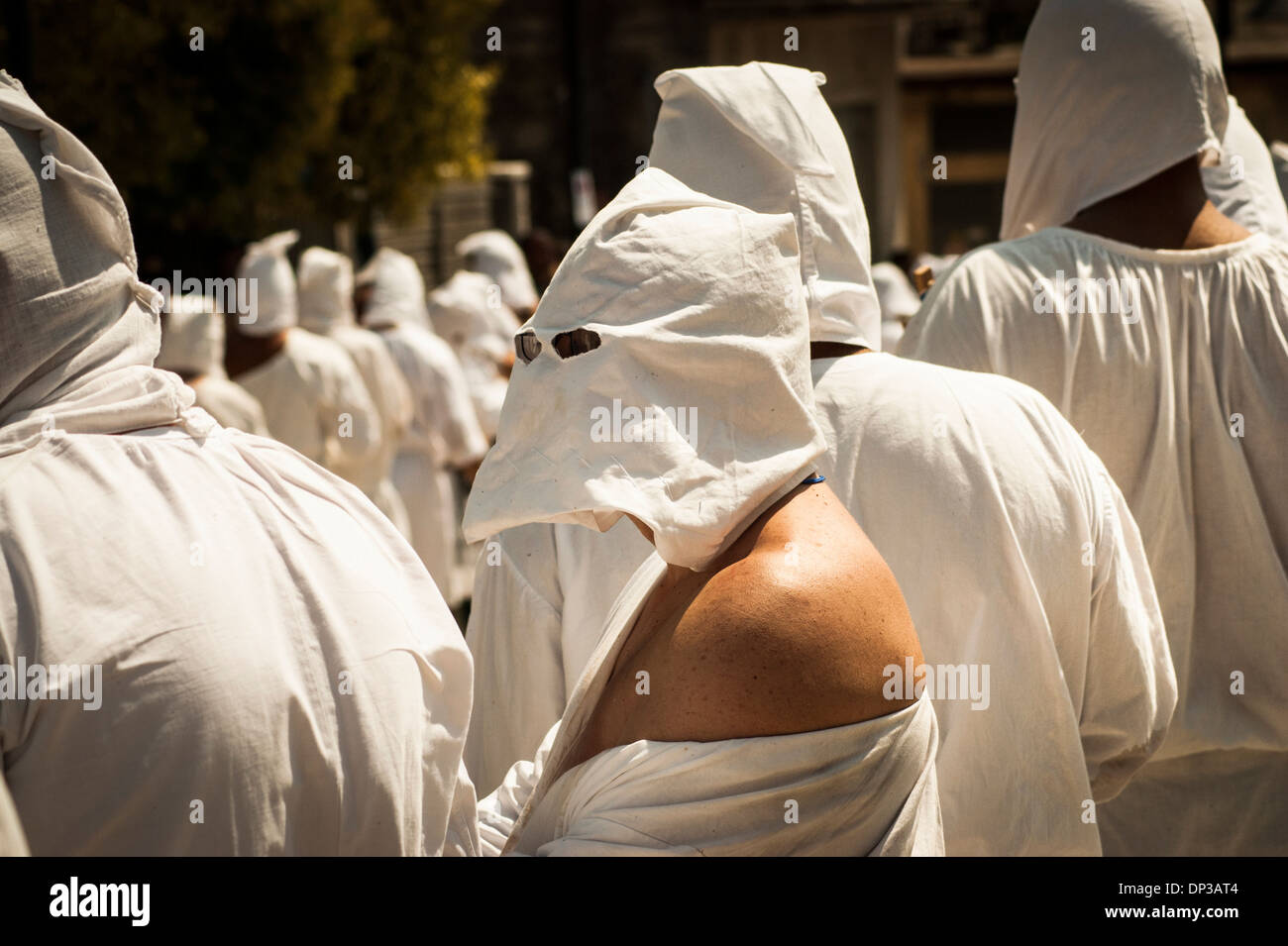 Penitents during the bloody procession for the Assumption of the Virgin Mary in Guardia Sanframondi, Campania, Italy Stock Photo