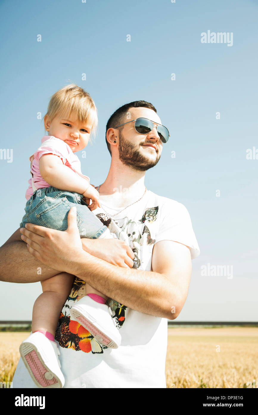 Father Holding Baby Daughter Outdoors, Mannheim, Baden-Wurttemberg, Germany Stock Photo