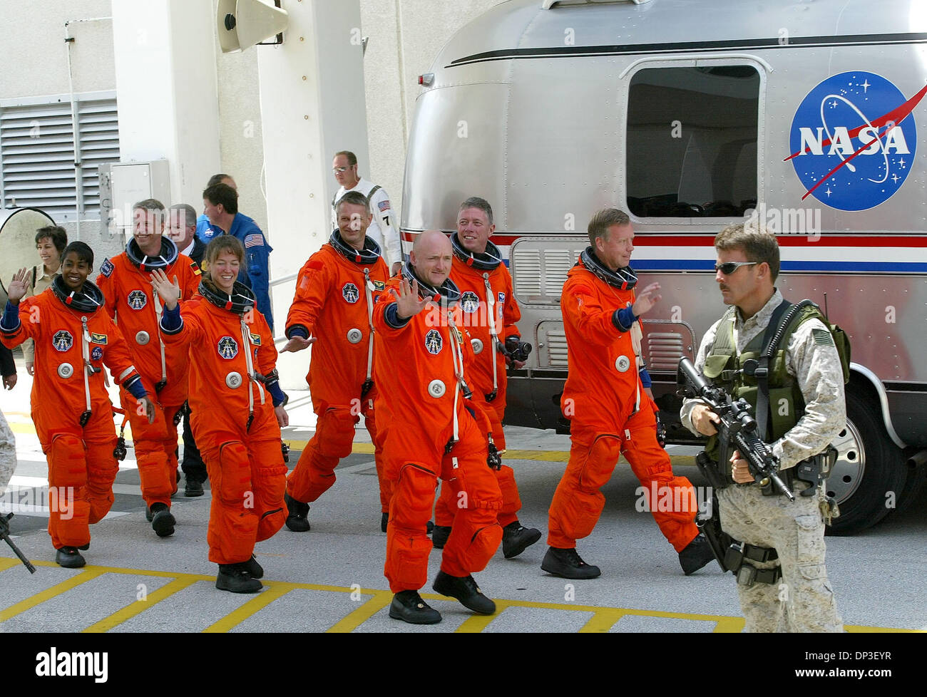Jul 01, 2006; Cape Canaveral, FL, USA; Space shuttle Discovery crew members walkout Saturday morning on their way to the space craft at Kennedy Space Center. (LtoR) Astronauts Stephanie D. Wilson, Thomas Reiter of Germany, Lisa M. Nowak, Peirs J. Sellers, Mark E. Kelly, Michael E. Fossum, and commander Steven W. Lindsey. Bad weather on Saturday and Sunday forced NASA to reschedule  Stock Photo