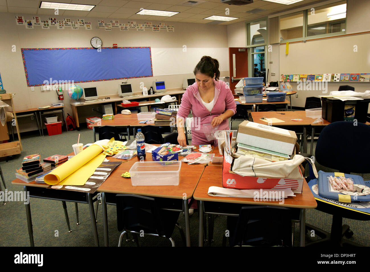 (Published 1/7/2006, B-1:R,S)  NCoceanview250666 x001 ................................ 6 January, 2006, San Diego ........................ 1st grade teacher Bertha Franco Lopez sorts through different teaching aids that she will hang on the wall of her brand new classroom.   UNION-TRIBUNE NELVIN CEPEDA Stock Photo