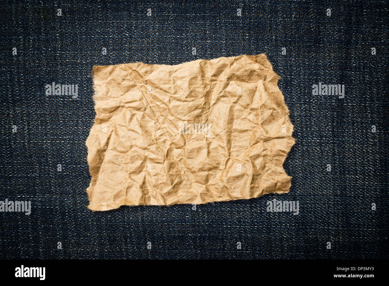 Crumpled paper ob blue jeans texture as copy space for your text or