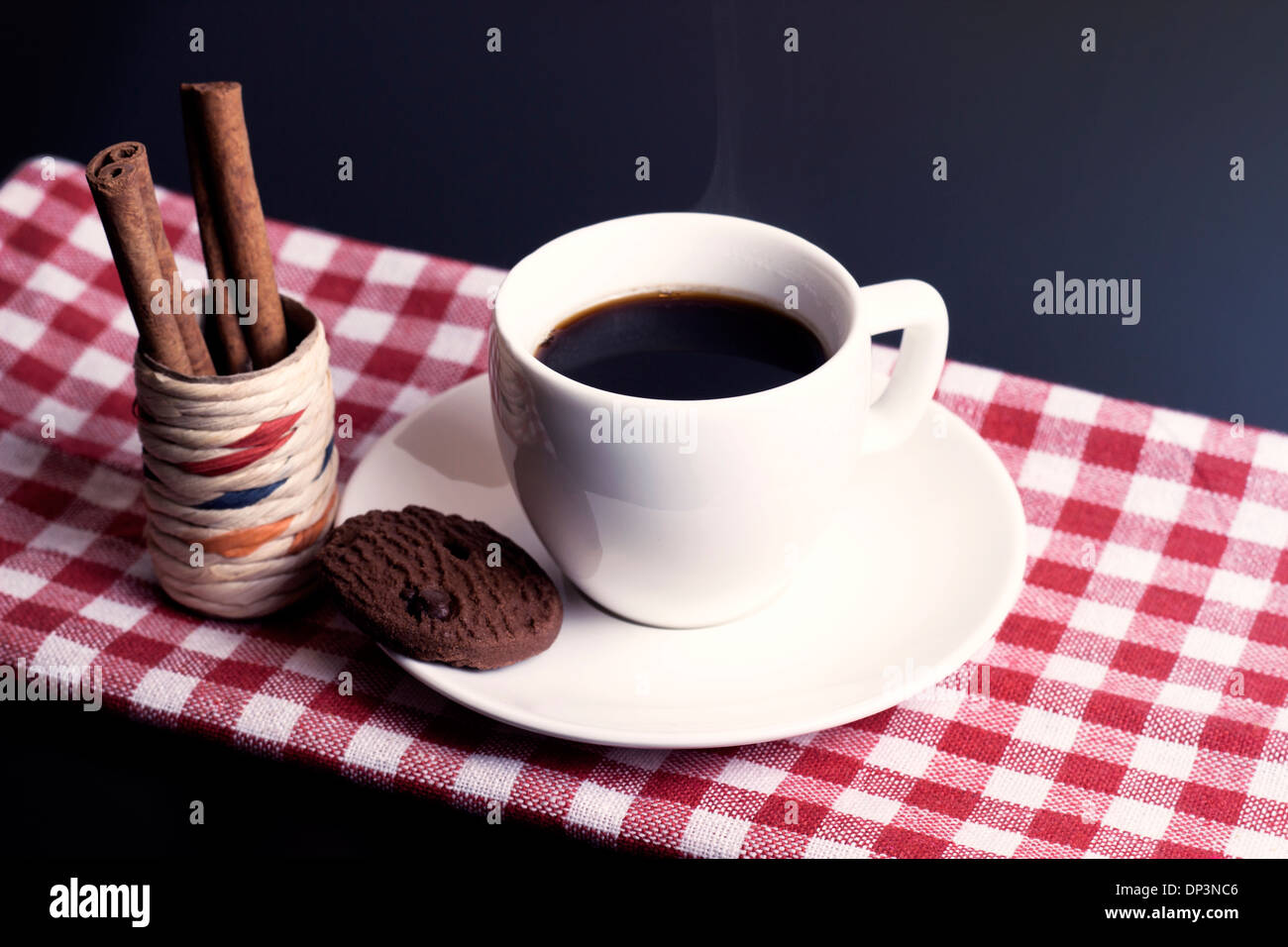 white coffee cup with biscuit on plate Stock Photo