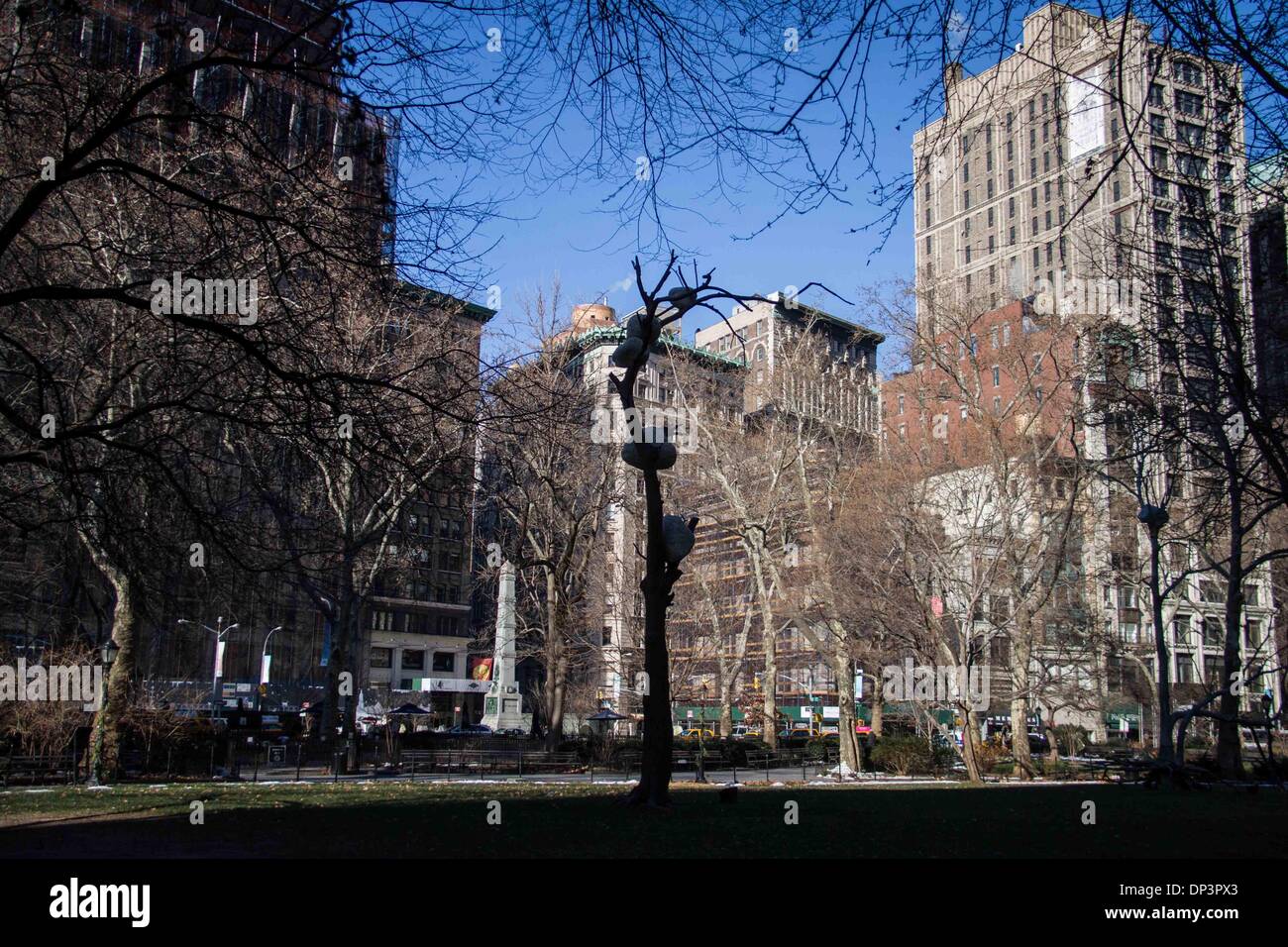 New York, Madison Square Park in New York. 7th Jan, 2014. A picture of one of the three bronze trees (with stones atop the arboreal branches) of Italian artist Giuseppe Penone's 'Ideas of Stone' installation, at Madison Square Park in New York, on Jan. 7, 2014. Penone, a member of the Italian Arte Povera movement, employs commonplace materials and natural forms in his exploration of the relationship between man and nature. © Niu Xiaolei/Xinhua/Alamy Live News Stock Photo