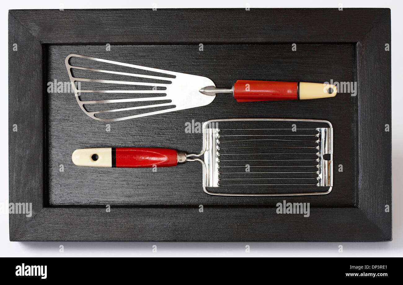 https://c8.alamy.com/comp/DP3RE1/close-up-of-mounted-vintage-kitchen-utensils-in-shadow-box-DP3RE1.jpg